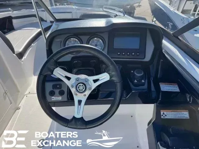 Slide: The Image of Steering wheel and dashboard of 2016 Yamaha Boats 242 LTD S at Boaters Exchange. - 8