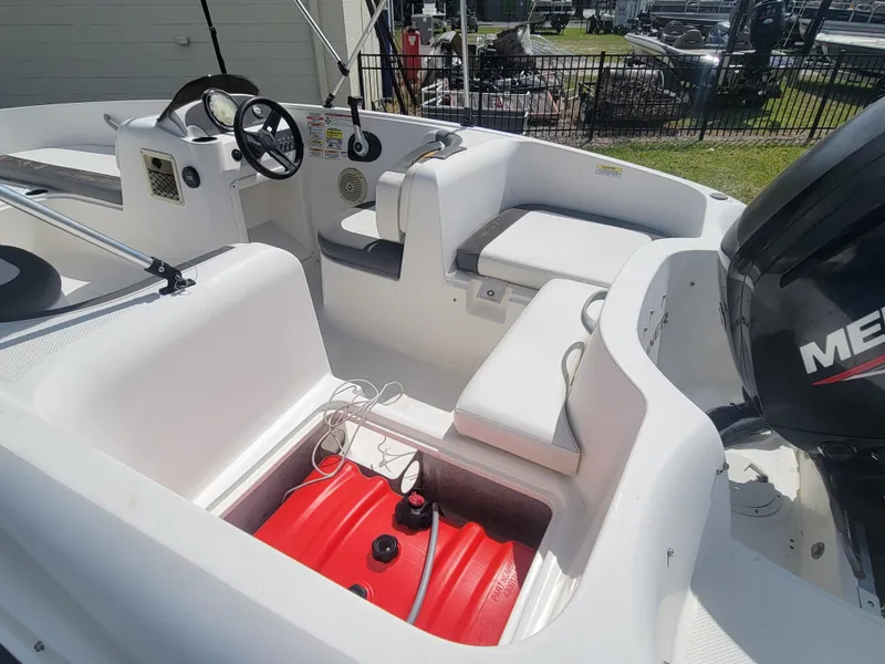 Slide: The Image of 2019 Bayliner Element E16 boat interior with seating and Mercury engine. - 7