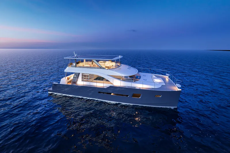 Slide: The Image of 2025 Catamaran HS 65 cruising on serene ocean at sunset. - 27