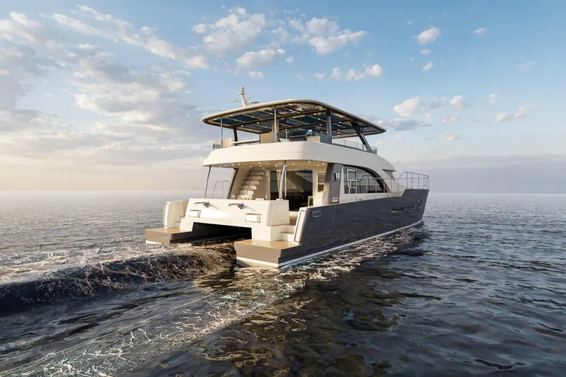 Slide: The Image of 2025 Catamaran HS 65 cruising on open water under a clear sky. - 3