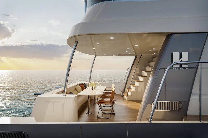 Slide: The Image of Luxurious 2025 Catamaran HS 65 deck with modern seating and ocean view at sunset. - 5