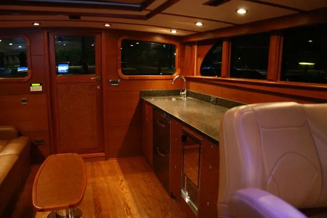 Slide: The Image of Luxurious interior of 2009 Hugh Saint 65 Commuter with wood finish and modern amenities. - 13