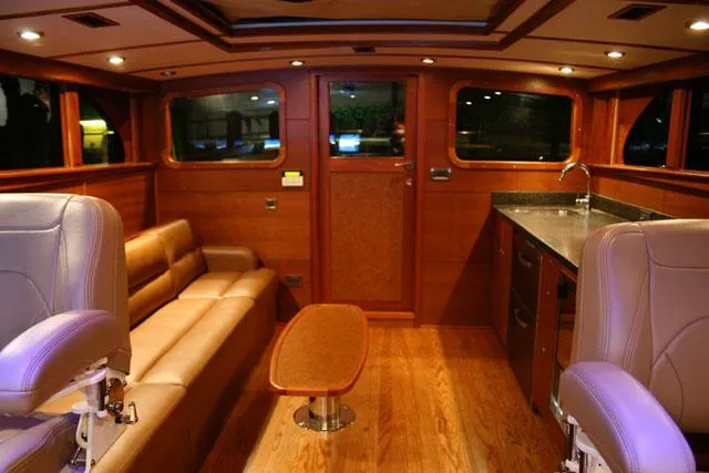 Slide: The Image of Luxurious interior of 2009 Hugh Saint 65 Commuter yacht with wood finishes and leather seating. - 14