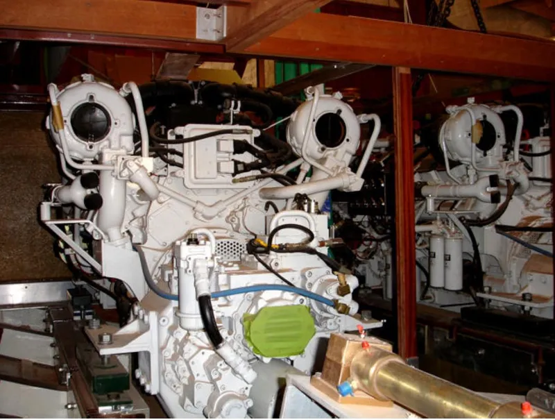 Slide: The Image of Engine room of a 2009 Hugh Saint 65 Commuter boat, showcasing complex machinery. - 18