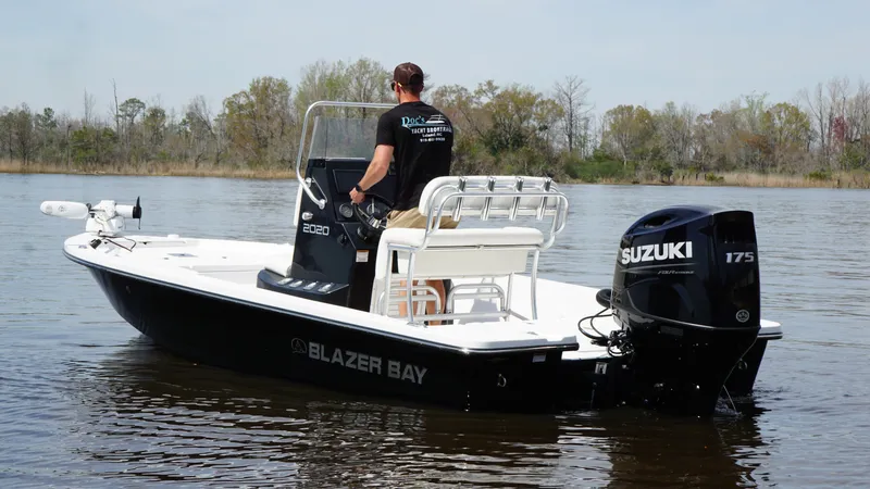 Slide: The Image of A 2022 Blazer Bay 2020 boat with Suzuki 175 engine on a calm lake. - 3