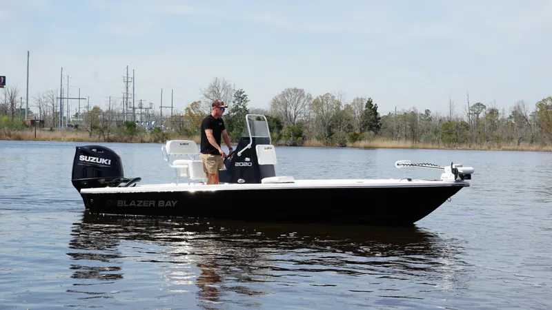 Slide: The Image of A 2022 Blazer Bay 2020 boat with Suzuki engine on calm water. - 6