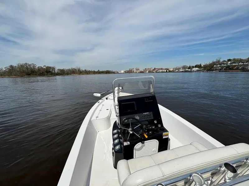 Slide: The Image of Blazer Bay 2020 boat on calm water, clear sky, 2022 model. - 9