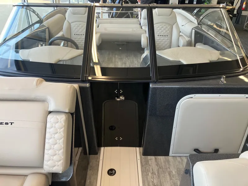 Slide: The Image of 2025 Crest Continental 250 SLS boat interior with luxurious seating and modern design. - 13