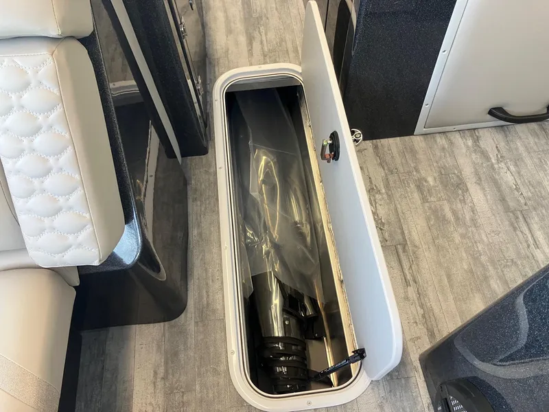 Slide: The Image of Storage compartment in 2025 Crest Continental 250 SLS boat, featuring sleek interior design. - 14
