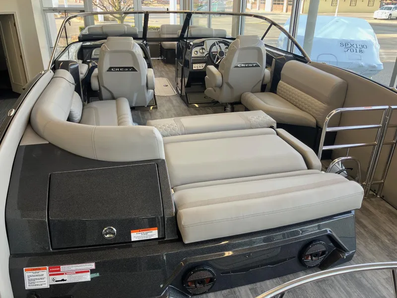 Slide: The Image of 2025 Crest Continental 250 SLS boat interior with luxurious seating and modern design. - 4