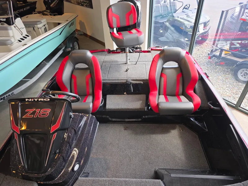 Slide: The Image of 2025 Nitro Z18 Pro boat interior with red and gray seating, showcasing modern design. - 4