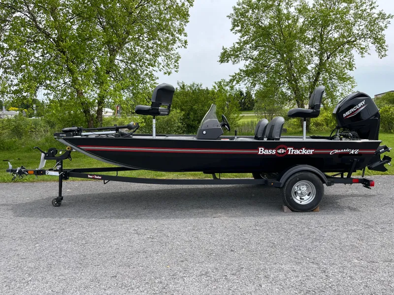 The Image of 2025 Tracker Bass Tracker Classic XL boat on trailer, parked outdoors. - 0