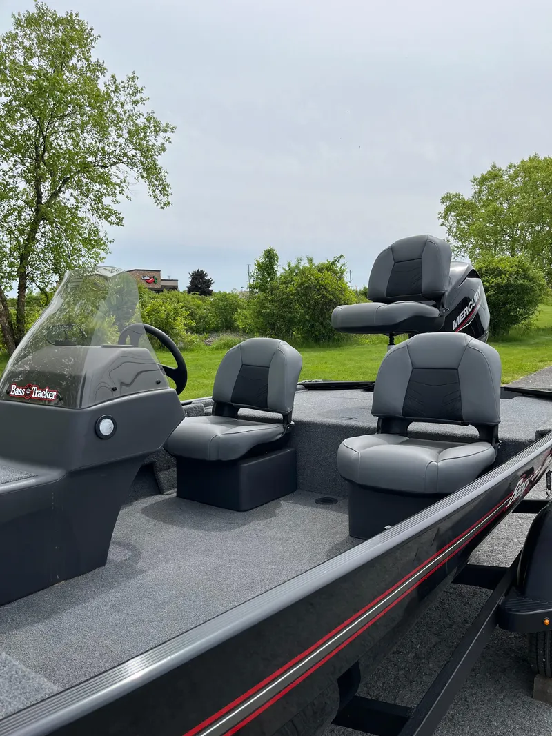 Slide: The Image of 2025 Tracker Bass Tracker Classic XL boat with seating, outdoors. - 3