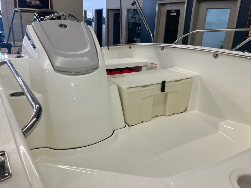 Slide: The Image of 2025 Boston Whaler 160 Super Sport interior with storage compartment and sleek design. - 3