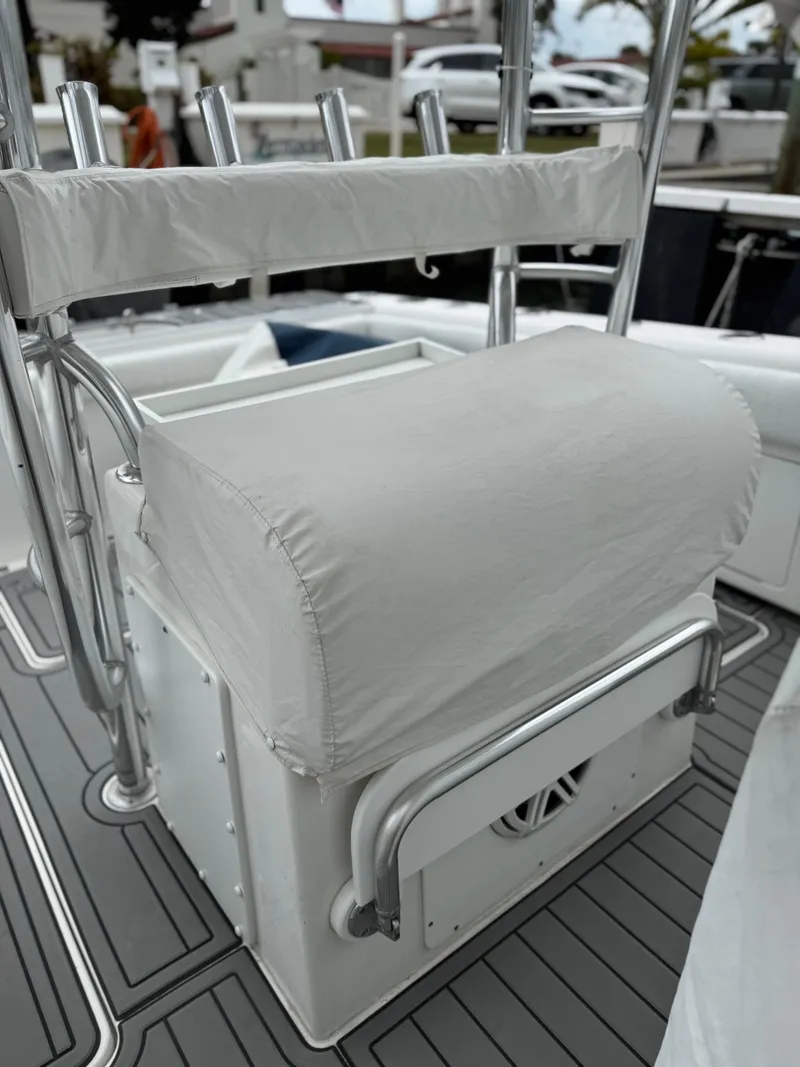 Slide: The Image of 2004 Palmetto 33 Adventure boat seat with rod holders and storage on deck. - 12