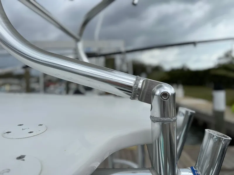 Slide: The Image of Close-up of a 2004 Palmetto 33 Adventure boat's metal railing against a cloudy sky. - 8