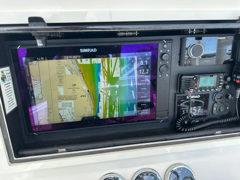 Slide: The Image of Control panel of a 2006 Island Runner 35 boat with navigation equipment. - 11