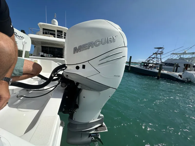 Slide: The Image of Outboard motor on 2006 Island Runner 35 boat in marina, sunny day. - 22