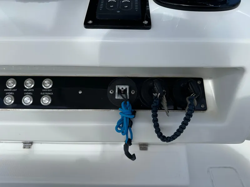 Slide: The Image of Control panel of a 2006 Island Runner 35 boat with switches and keys. - 6