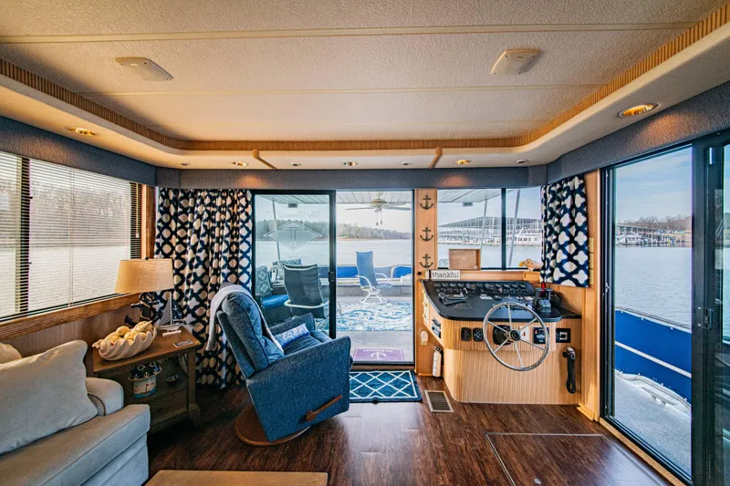 Slide: The Image of Interior of 1997 Stardust Cruisers 72x16 houseboat with cozy seating and helm view. - 24