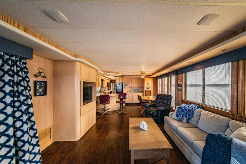 Slide: The Image of Interior of a 1997 Stardust Cruisers 72x16 houseboat with cozy seating and modern decor. - 28