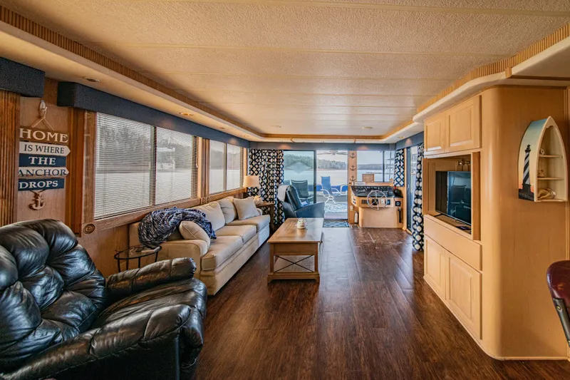 Slide: The Image of Interior of 1997 Stardust Cruisers 72x16 houseboat with cozy seating and nautical decor. - 29