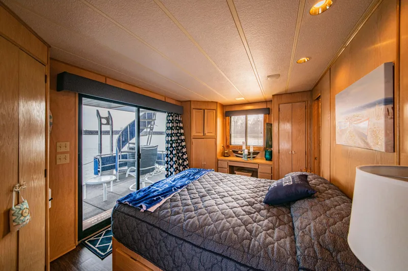 Slide: The Image of Cozy bedroom in 1997 Stardust Cruisers 72x16 houseboat with lake view and modern decor. - 35