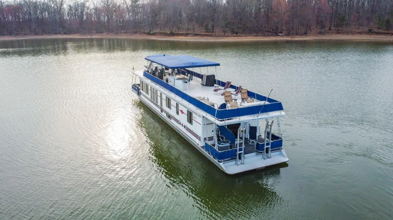 Slide: The Image of Houseboat on a lake, 1997 Stardust Cruisers 72x16, with upper deck seating. - 5
