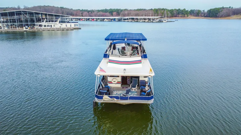 Slide: The Image of Aerial view of 1997 Stardust Cruisers 72x16 houseboat on a serene lake. - 6