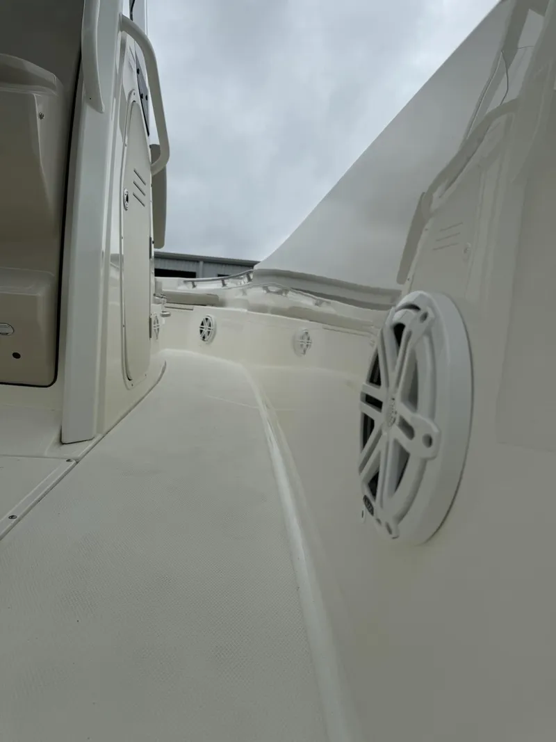 Slide: The Image of 2022 Boston Whaler 220 Dauntless boat interior with speaker detail. - 15