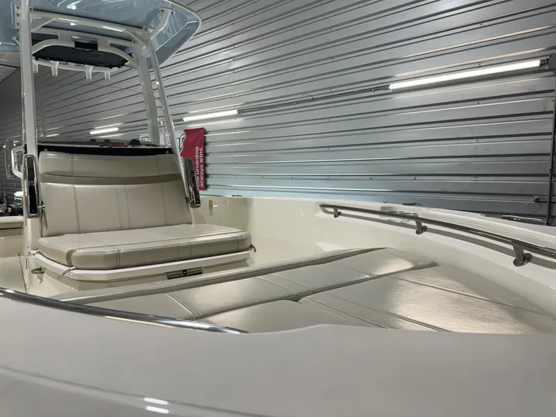 Slide: The Image of 2022 Boston Whaler 220 Dauntless boat interior with seating and sleek design. - 19