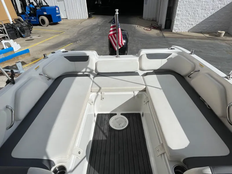 Slide: The Image of 2021 Bayliner Element E21 boat interior with seating and American flag. - 15