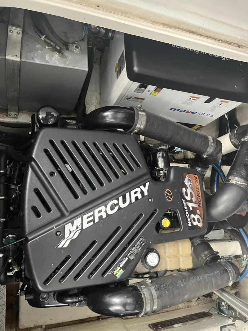 Slide: The Image of Mercury engine in 2003 Sea Ray 360 Sundancer boat, showcasing mechanical components. - 15