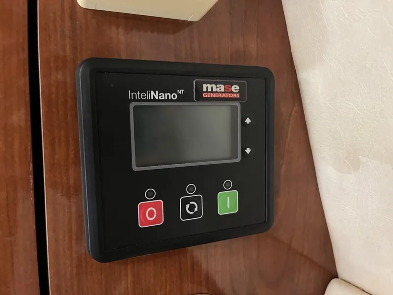 Slide: The Image of Control panel of a 2003 Sea Ray 360 Sundancer with Mase Generators display. - 20