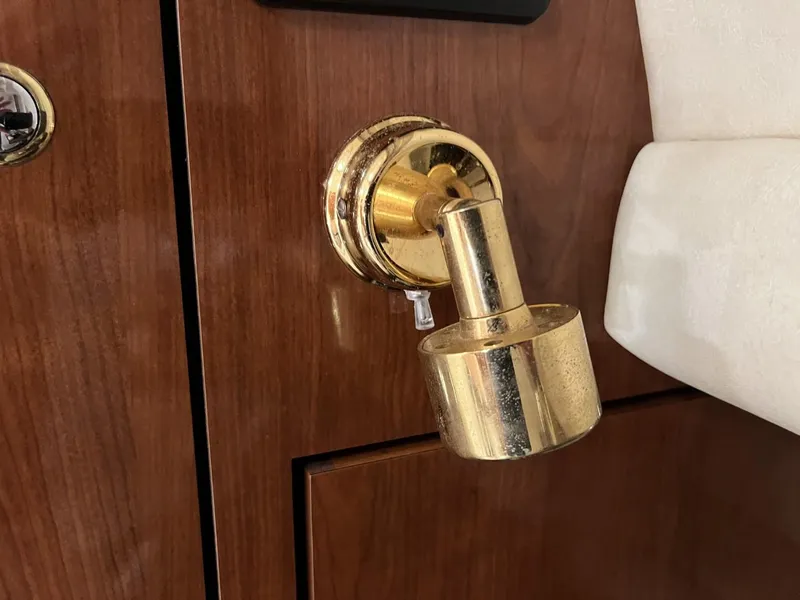 Slide: The Image of Gold door latch on 2003 Sea Ray 360 Sundancer yacht interior. - 22