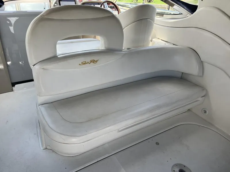Slide: The Image of 2003 Sea Ray 360 Sundancer interior seating with white upholstery. - 38