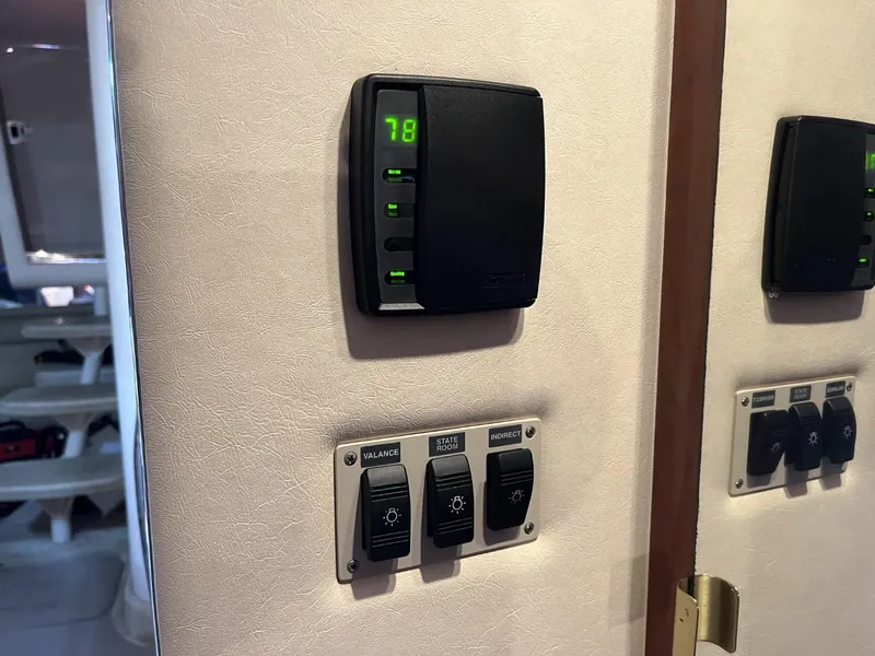 Slide: The Image of Thermostat and control panel inside 2003 Sea Ray 360 Sundancer yacht cabin. - 46