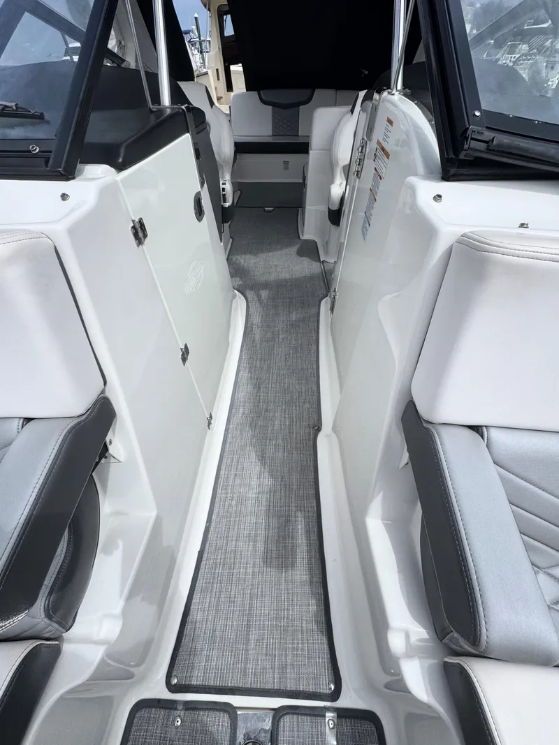 Slide: The Image of Interior view of 2018 Chaparral 307 SSX boat, featuring sleek seating and modern design. - 16