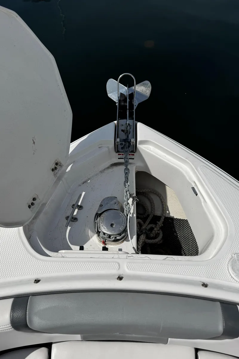 Slide: The Image of 2018 Chaparral 307 SSX boat anchor compartment with open hatch. - 20