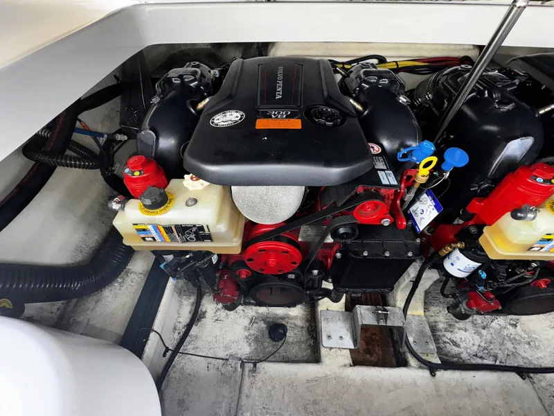 Slide: The Image of Engine compartment of a 2018 Chaparral 307 SSX boat, showcasing detailed components. - 22