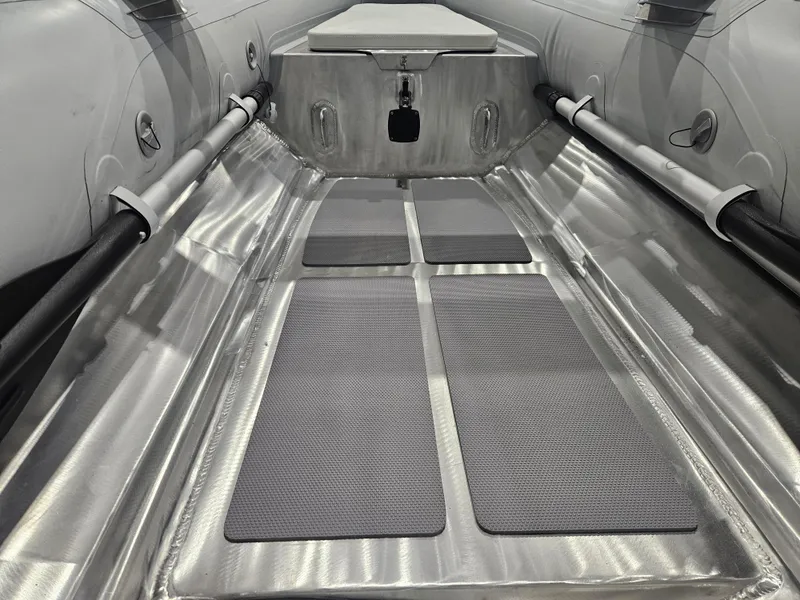 Slide: The Image of 2024 AB Inflatables Lammina 9.5 AL interior with aluminum flooring and seating. - 14