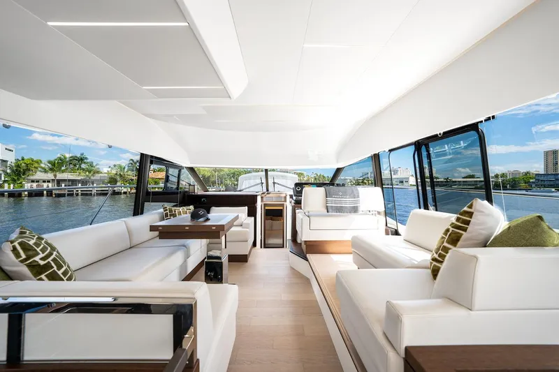 Slide: The Image of Luxurious interior of 2020 Prestige 520 Fly yacht with elegant seating and scenic water views. - 16