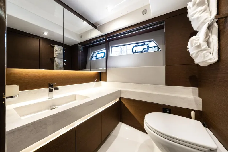 Slide: The Image of Luxurious bathroom interior on a 2020 Prestige 520 Fly yacht, featuring modern fixtures and elegant design. - 24
