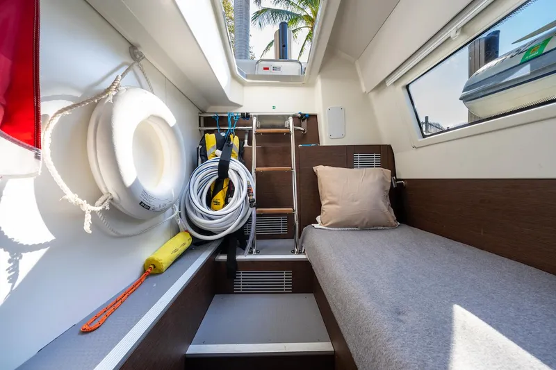 Slide: The Image of Cozy cabin interior of 2020 Prestige 520 Fly yacht with bed, life preserver, and equipment. - 29