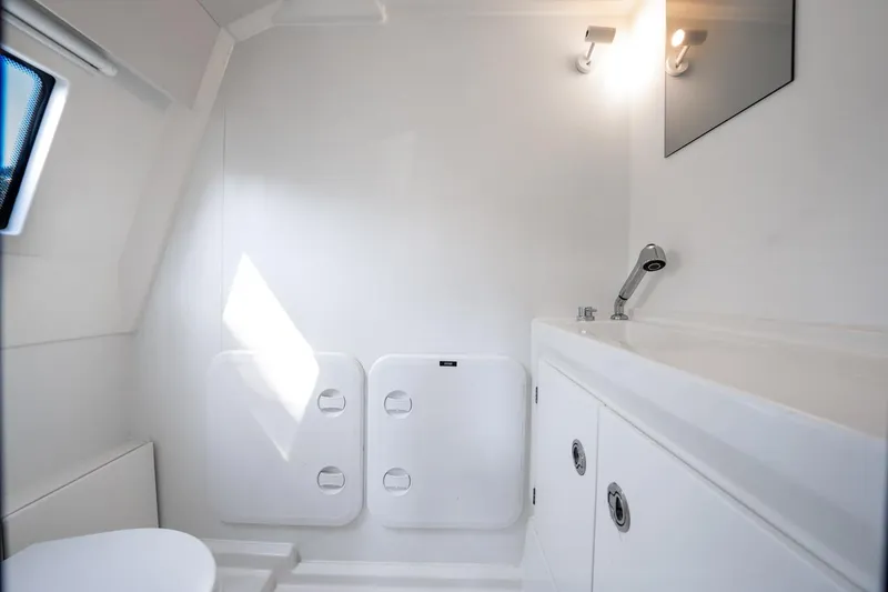 Slide: The Image of Modern bathroom interior on 2020 Prestige 520 Fly yacht, featuring sleek white design and fixtures. - 30