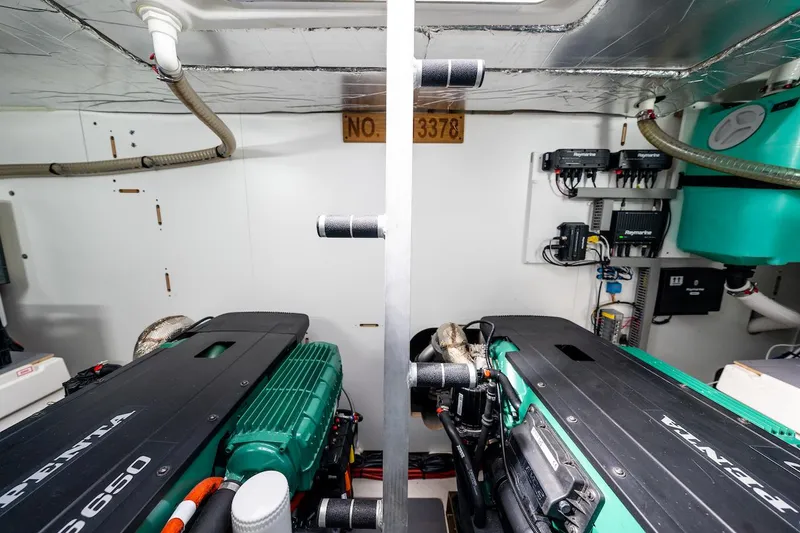 Slide: The Image of Engine room of a 2020 Prestige 520 Fly yacht, featuring dual Volvo Penta engines. - 32