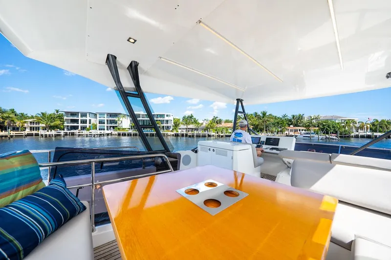 Slide: The Image of Luxurious 2020 Prestige 520 Fly yacht deck with waterfront view and modern seating. - 7