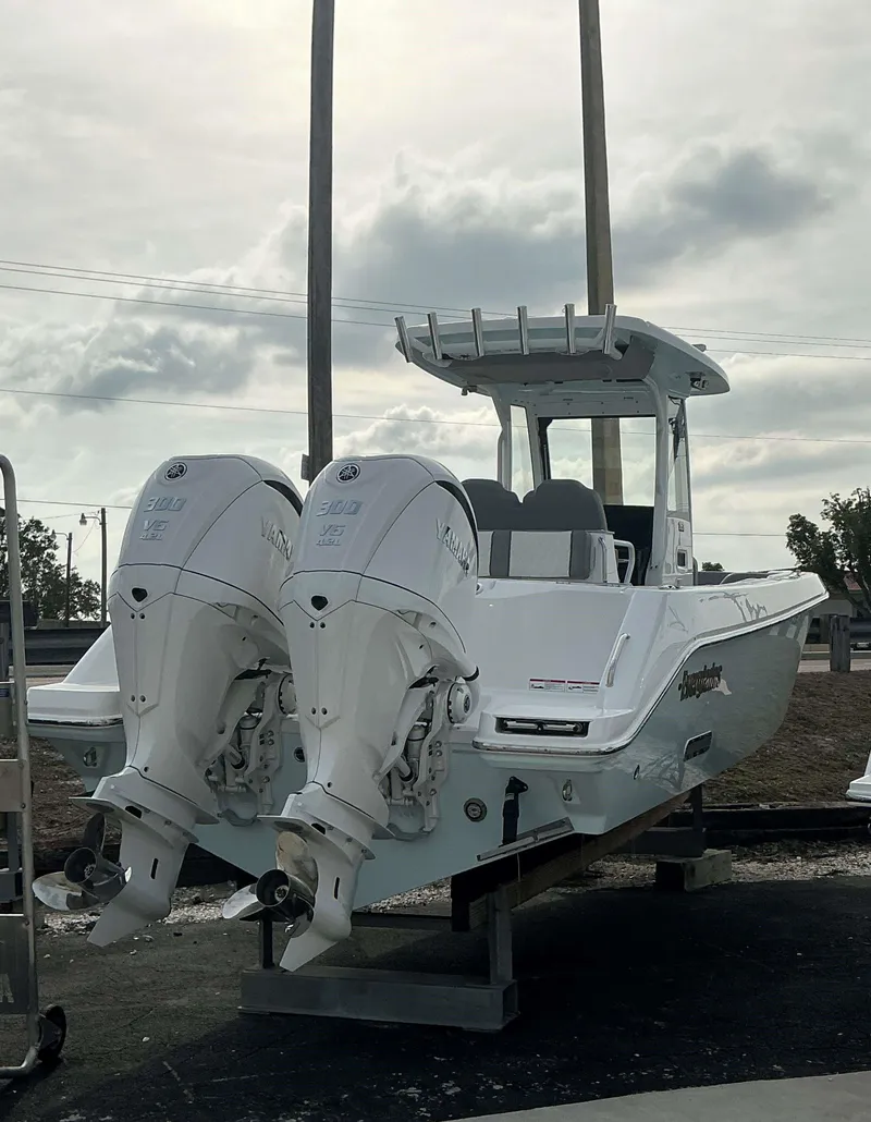 Slide: The Image of 2025 Everglades 285 CC boat with dual Yamaha outboard engines on display. - 3