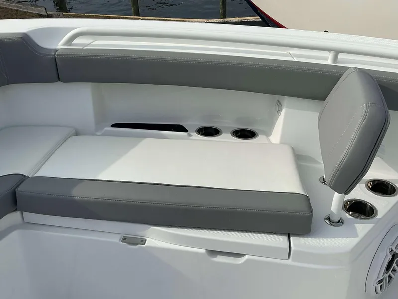 Slide: The Image of 2025 Everglades 285 CC boat seating area with cup holders and cushioned seats. - 7