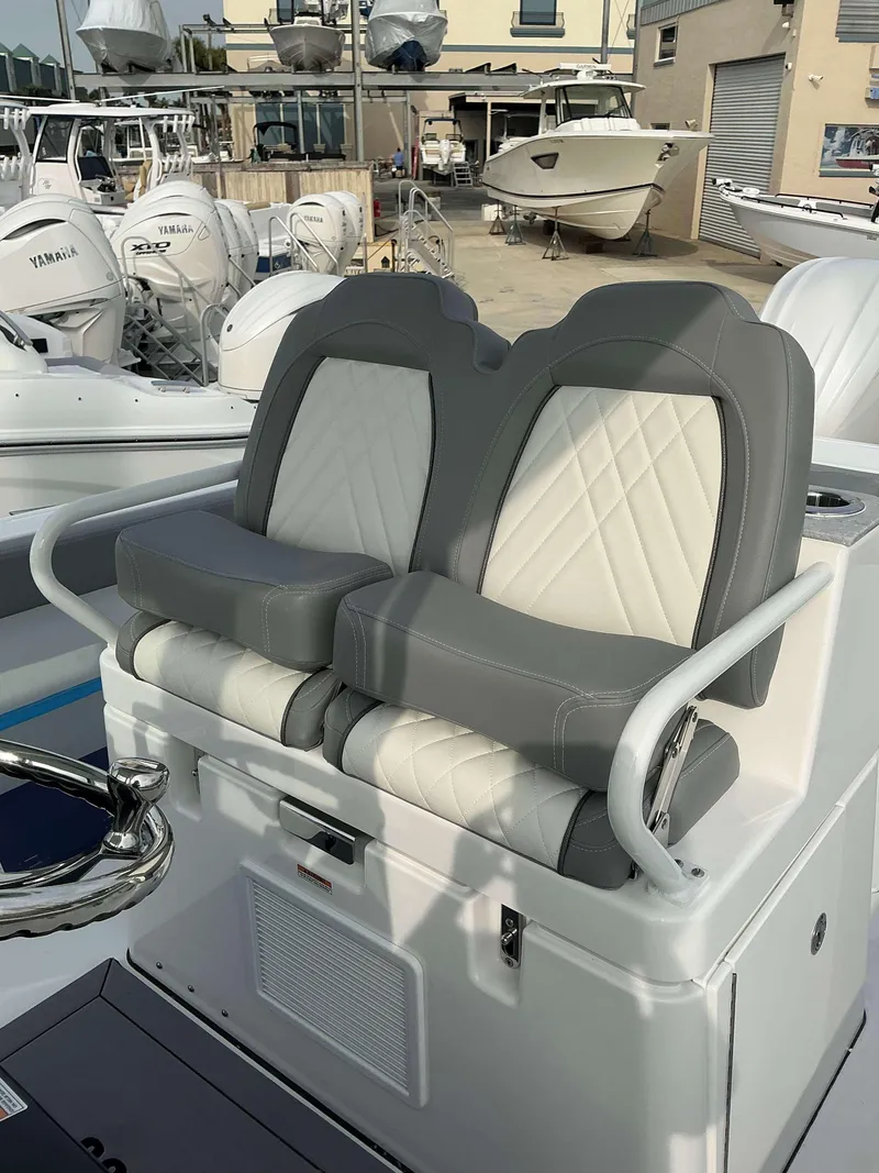 Slide: The Image of Luxury seating on 2025 Everglades 285 CC boat, featuring gray and white upholstery. - 8